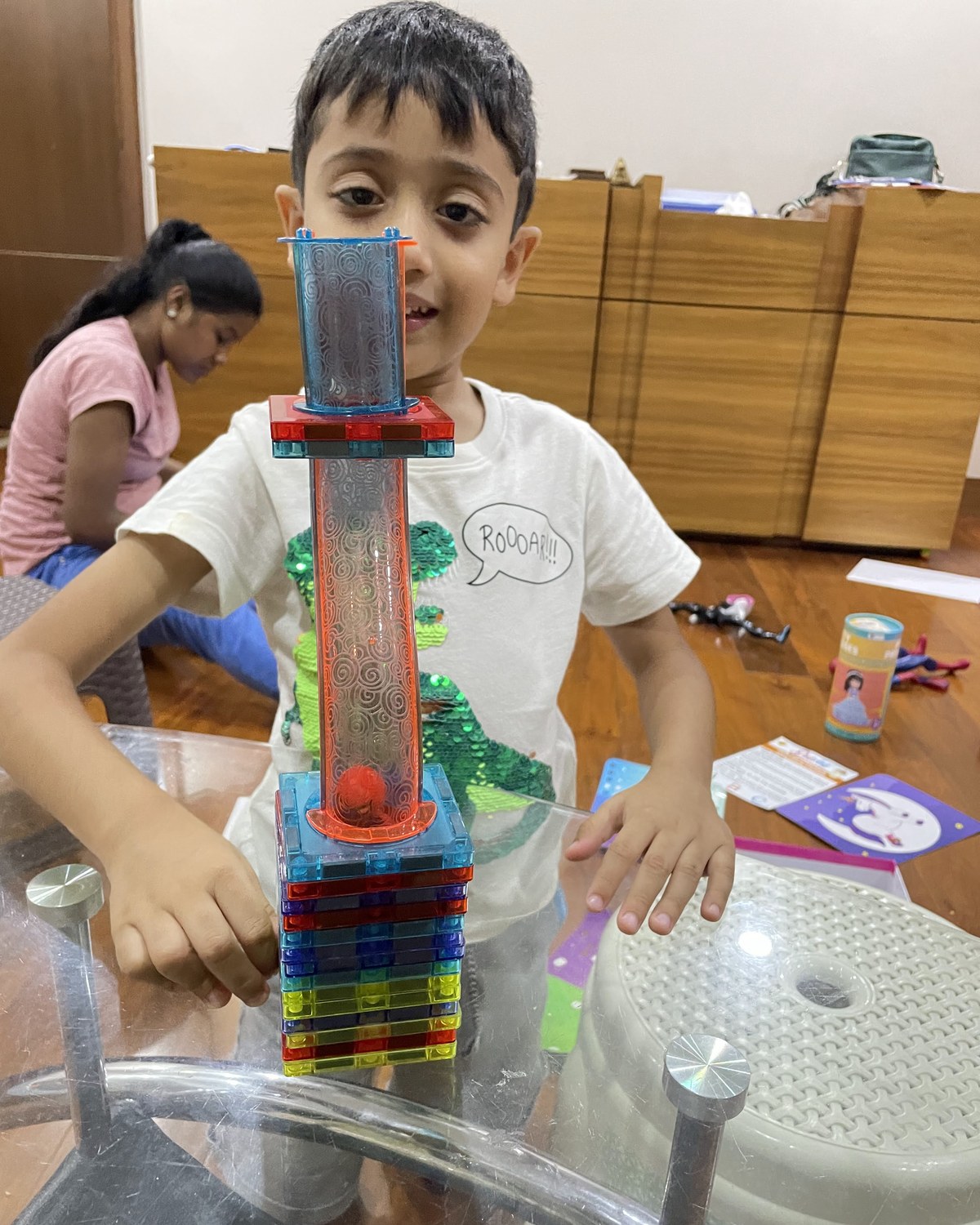Child building magnetic tower